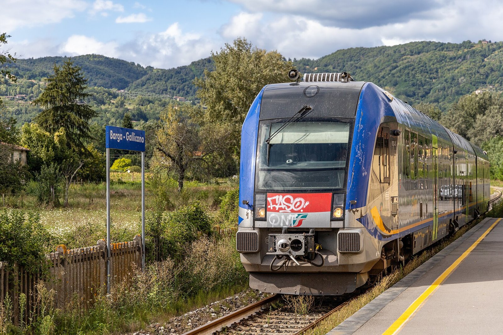 A regional train arriving at Barga-Gallicano station in the Serchio valley