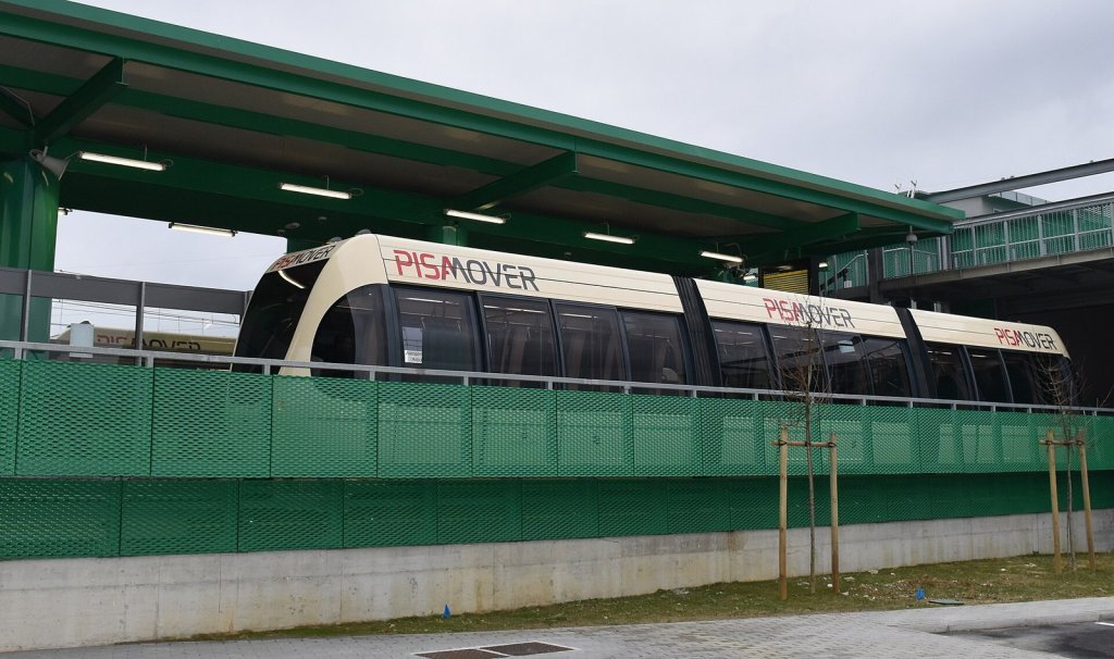 The small PisaMover shuttle train on its raised track