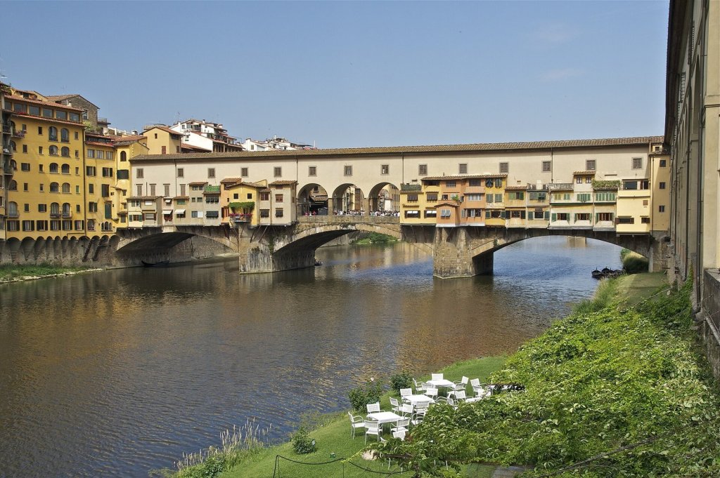 The Ponte Vecchio and its little shops built over the River Arno in Florence