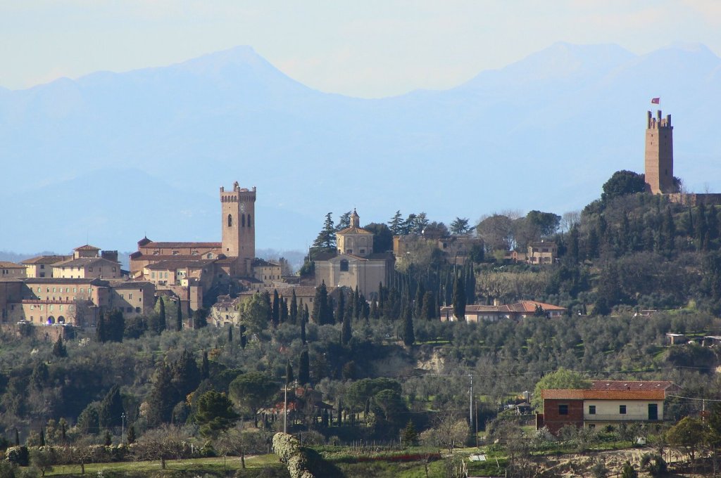 The towers and rooftops of San Miniato along a hilltop ridge