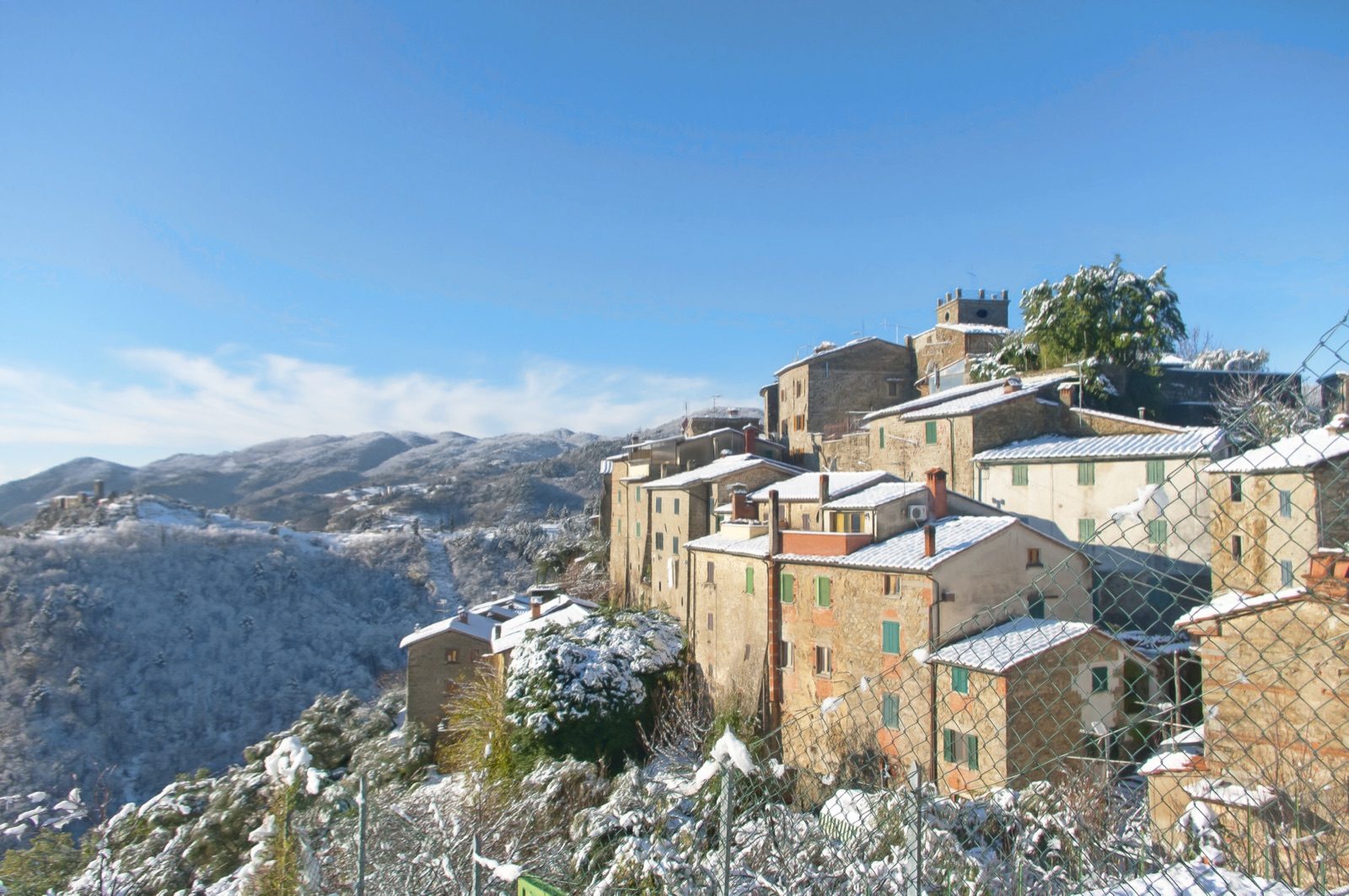 Snow on the old stone houses of Sorana
